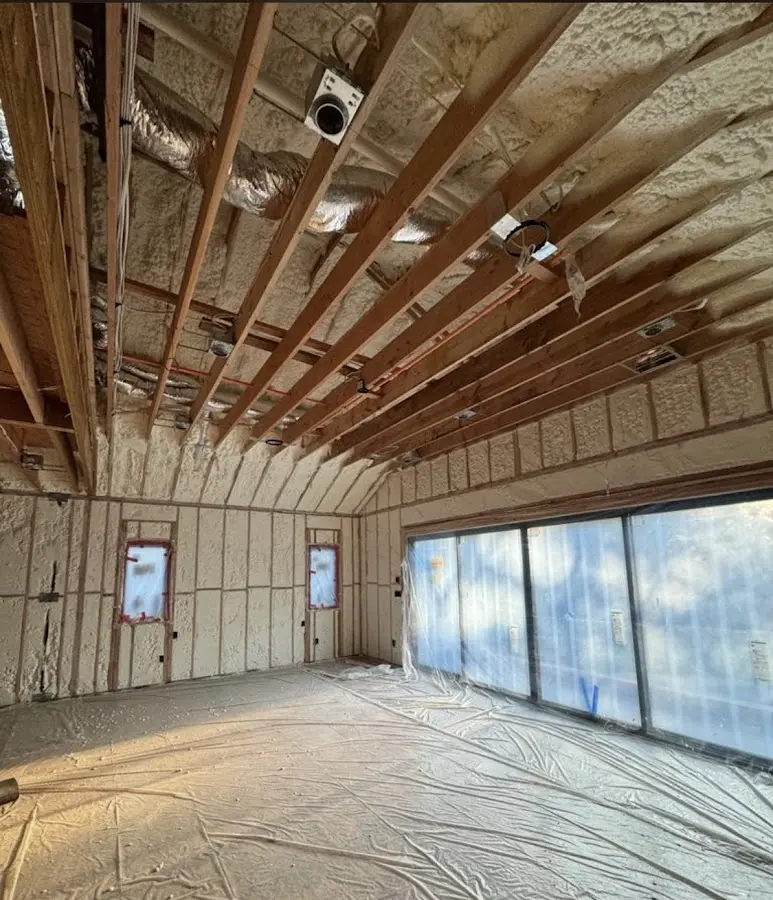 Interior walls and ceiling insulated with spray foam during new construction in Dover